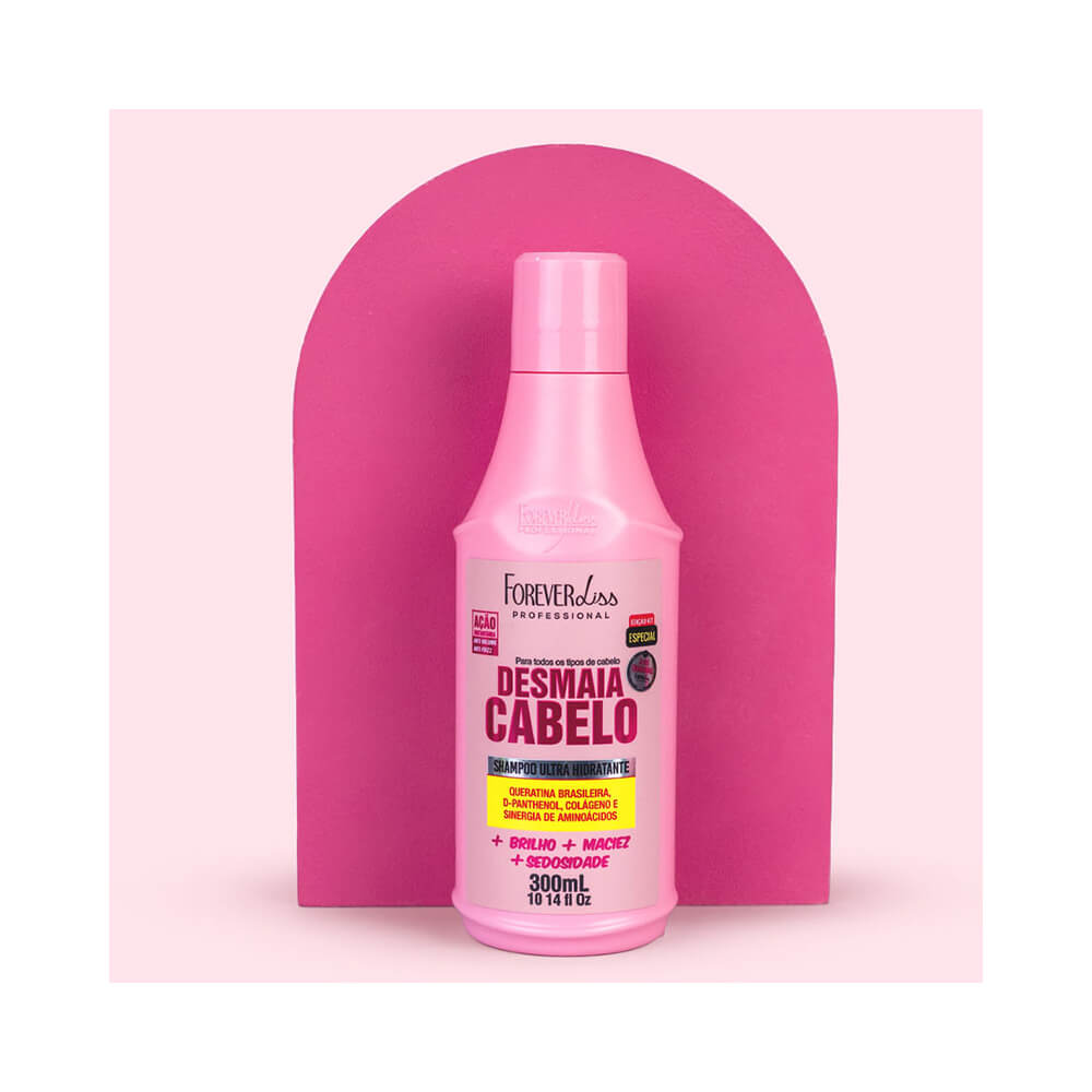 Shampoo Forever Liss Desmaia Cabelo 300ml em fundo rosa claro, com arco rosa escuro ao fundo, imagem frontal do produto.