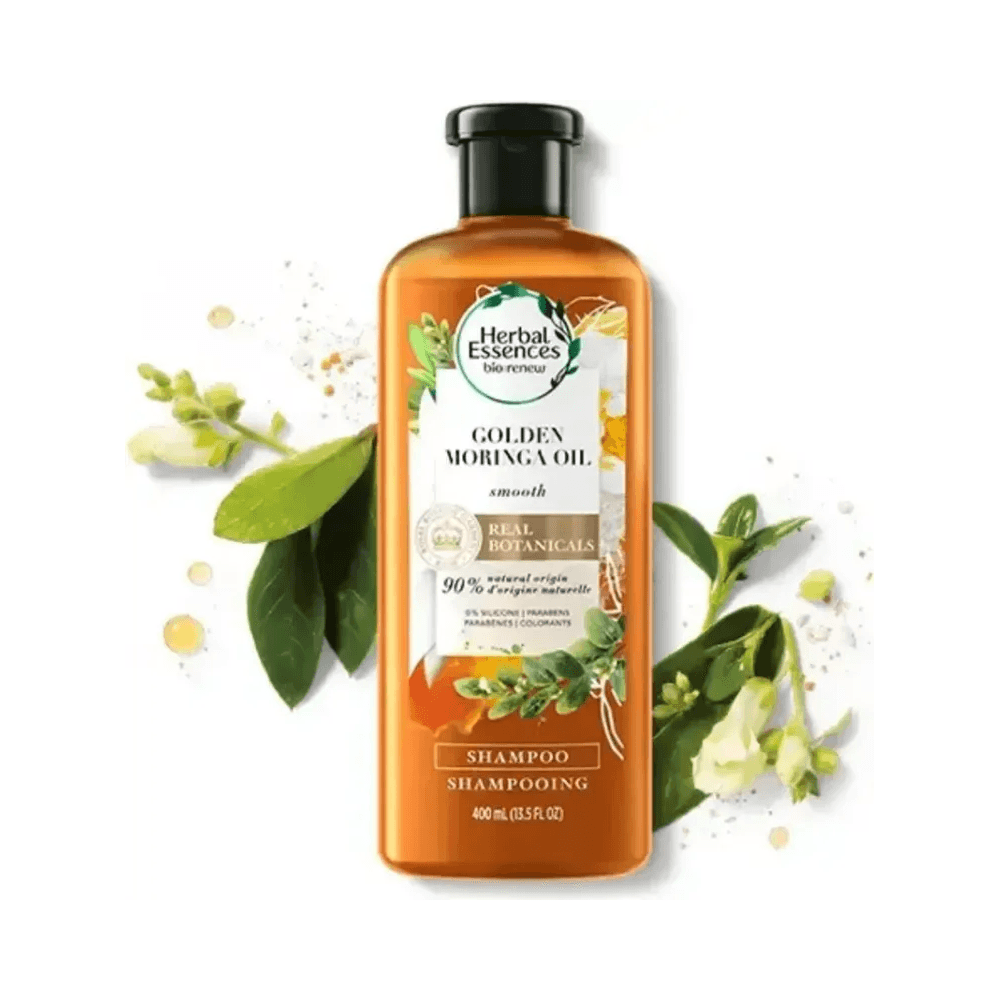 Frasco frontal do Shampoo Herbal Essences Golden Moringa Oil com elementos botânicos